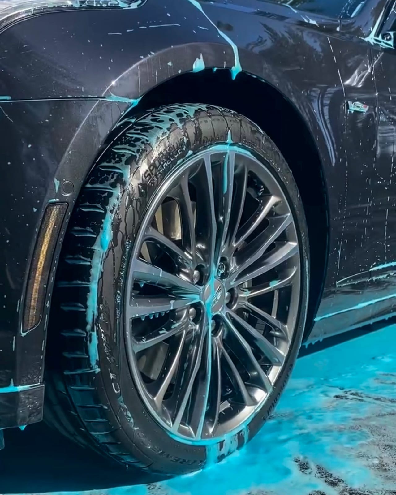 Wheel and tire being detailed with soap